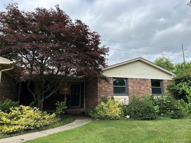 17018 White Haven Dr, Northville, MI 48168 - ranch-style home featuring brick siding and a front yard