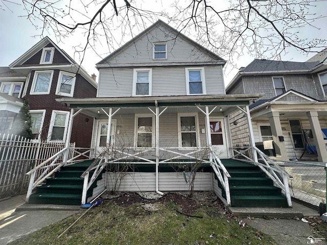 1073-1075 Morrell St, Detroit, MI 48209 - view of front of house with fence and covered porch