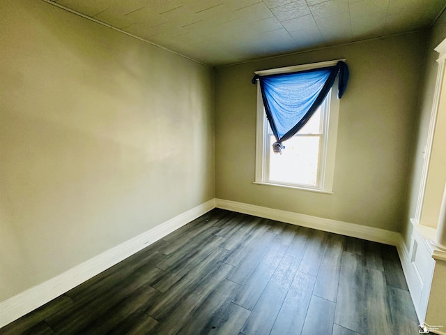 1073-1075 Morrell St, Detroit, MI 48209 - empty room with dark wood-type flooring and baseboards