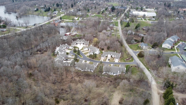 birds eye view of property featuring a residential view and a water view