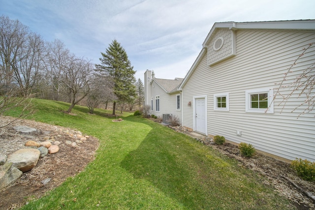 view of yard featuring central AC unit