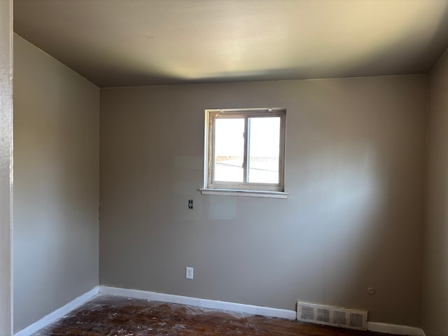 spare room with visible vents and baseboards