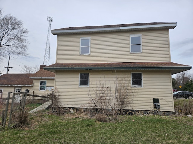 4950 Cottrell Rd, Vassar, MI 48768 - back of house featuring fence, roof with shingles, and crawl space