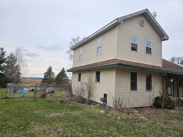 4950 Cottrell Rd, Vassar, MI 48768 - view of side of home featuring a yard and fence