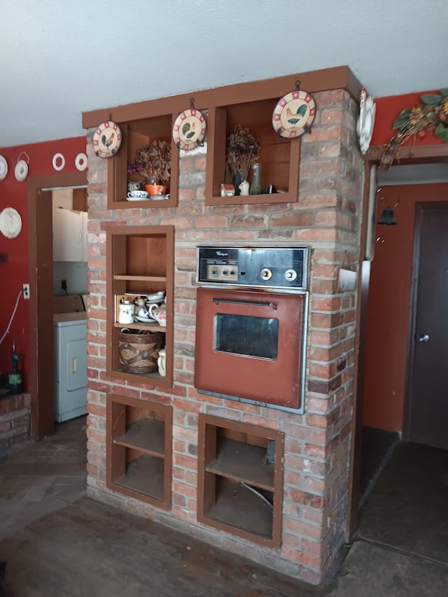 4950 Cottrell Rd, Vassar, MI 48768 - kitchen featuring washer / clothes dryer, oven, and open shelves