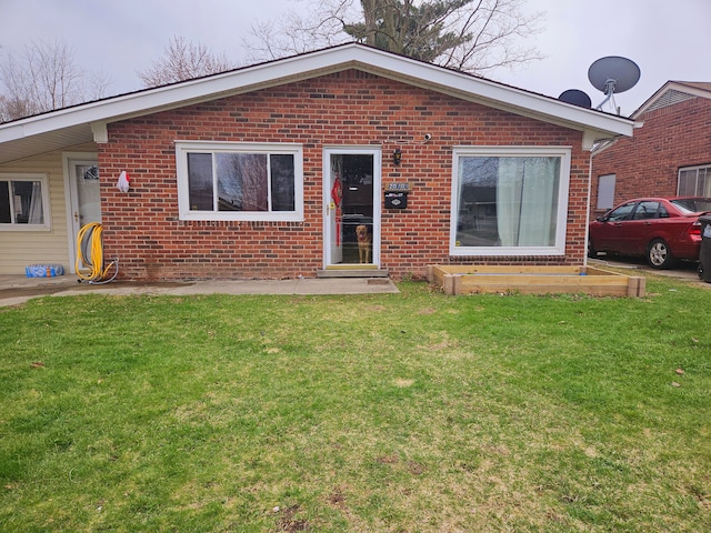 20709 Lockwood St, Taylor, MI 48180 - view of front of property featuring brick siding and a front lawn