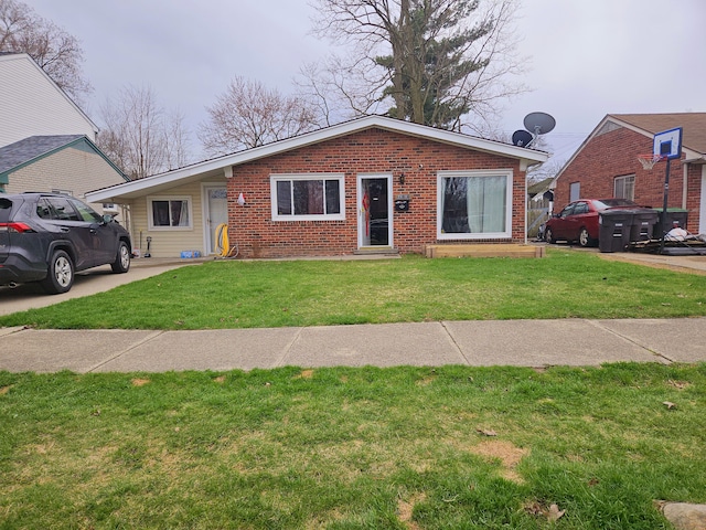 20709 Lockwood St, Taylor, MI 48180 - view of front of property with brick siding and a front yard