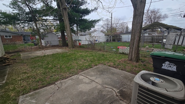 20709 Lockwood St, Taylor, MI 48180 - view of yard with a fenced backyard, central AC unit, and a patio