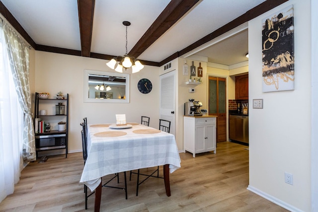 dining space with beamed ceiling, light wood-style flooring, baseboards, and an inviting chandelier