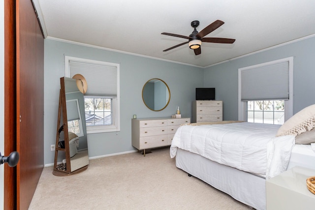 bedroom featuring carpet flooring, baseboards, ornamental molding, and ceiling fan