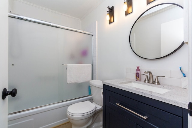 full bath with tasteful backsplash, bath / shower combo with glass door, toilet, crown molding, and vanity