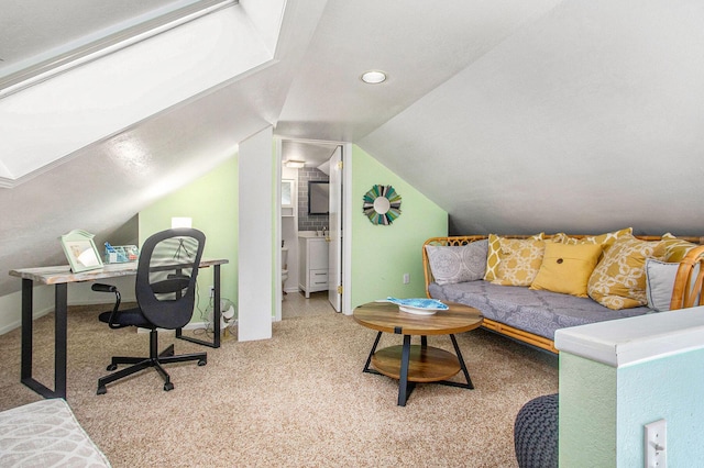 carpeted office featuring baseboards and lofted ceiling