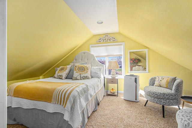 bedroom with carpet flooring and lofted ceiling
