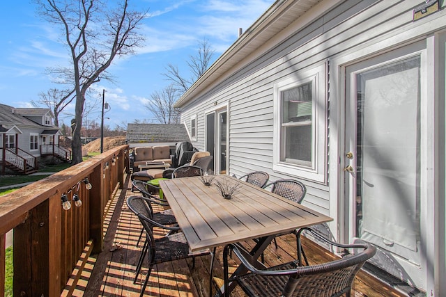 deck featuring outdoor dining area