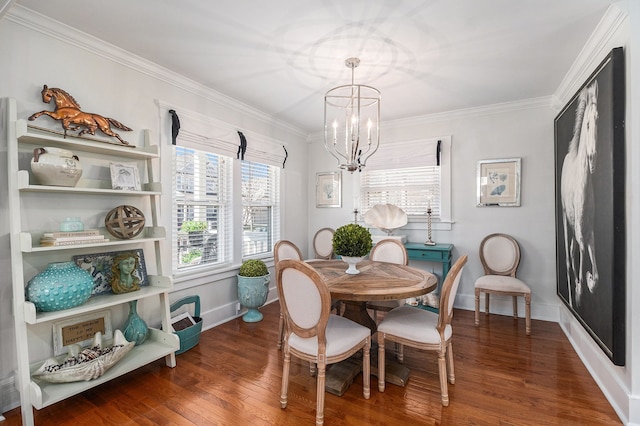 dining room with baseboards, an inviting chandelier, ornamental molding, and wood finished floors