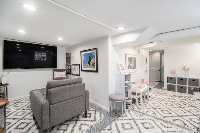 living area featuring baseboards, recessed lighting, and carpet flooring