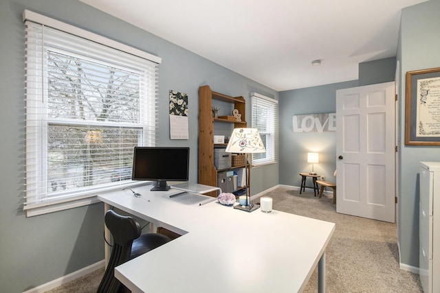 office space with light carpet and baseboards