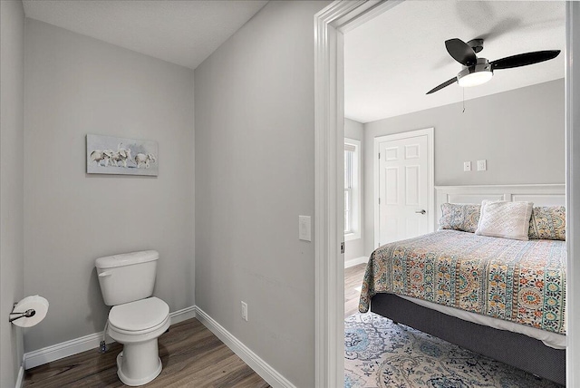 bedroom featuring baseboards, ceiling fan, and wood finished floors