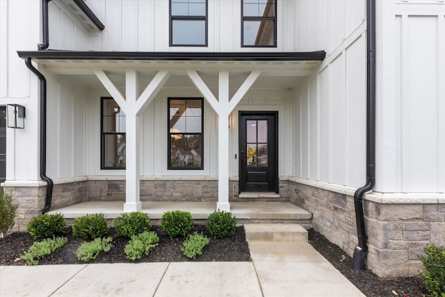50272 Hedgewood Dr, Canton, MI 48187 - property entrance featuring stone siding, board and batten siding, and a porch