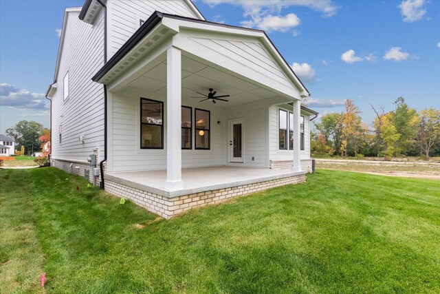 50272 Hedgewood Dr, Canton, MI 48187 - rear view of property with a lawn, ceiling fan, and a patio area