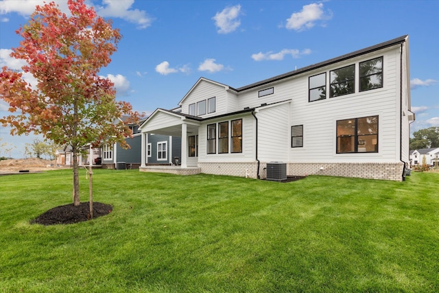 50272 Hedgewood Dr, Canton, MI 48187 - back of house featuring central air condition unit and a lawn