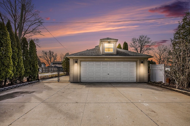 9861 Dixie, Ira, MI 48023 - garage at dusk with fence, a gate, and a detached garage