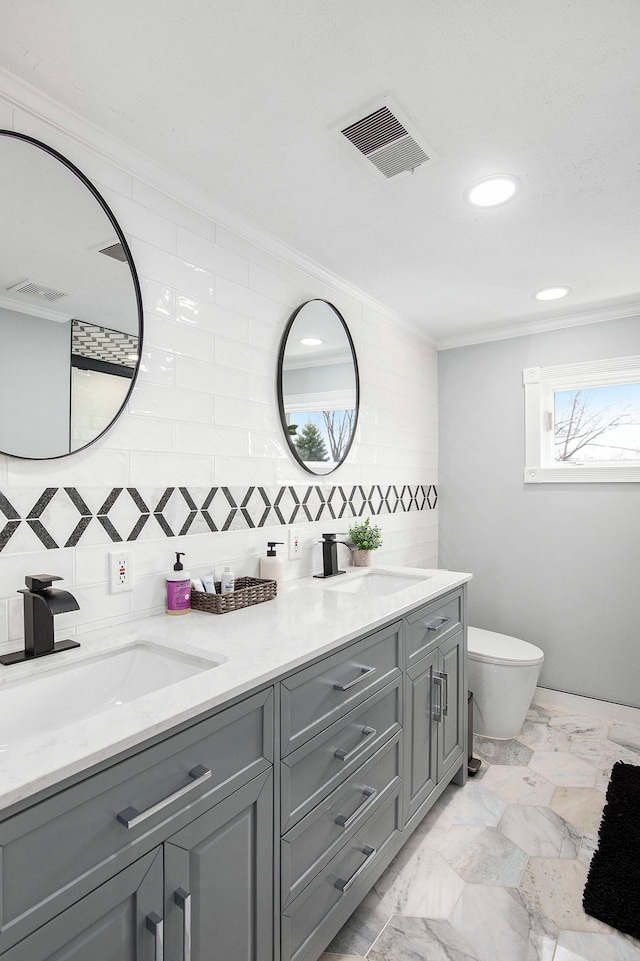 9861 Dixie, Ira, MI 48023 - bathroom featuring ornamental molding, visible vents, toilet, and a sink