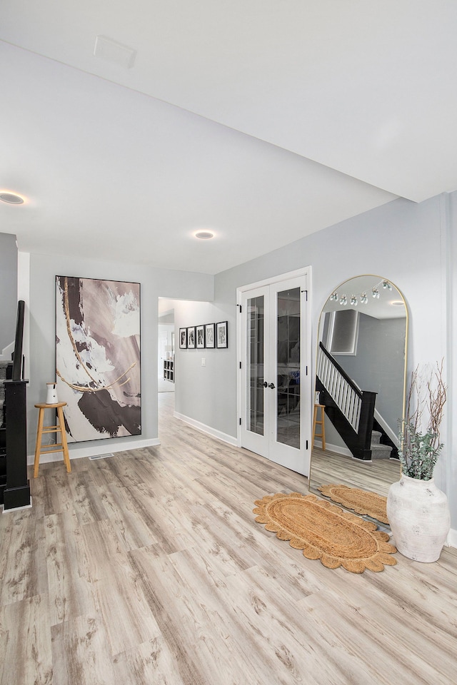 9861 Dixie, Ira, MI 48023 - living room with stairway, french doors, baseboards, and wood finished floors