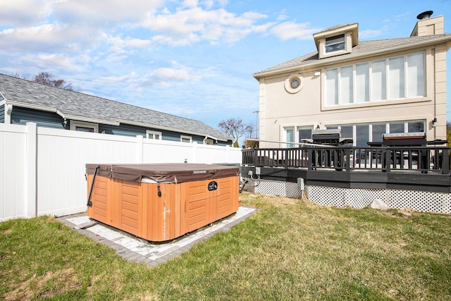 9861 Dixie, Ira, MI 48023 - back of house with a hot tub, a yard, fence, a chimney, and a deck