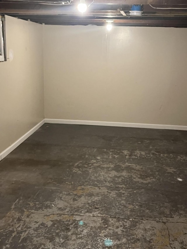 unfinished basement featuring baseboards