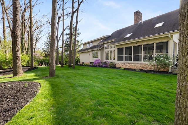 view of yard with a sunroom
