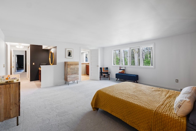 bedroom featuring light colored carpet