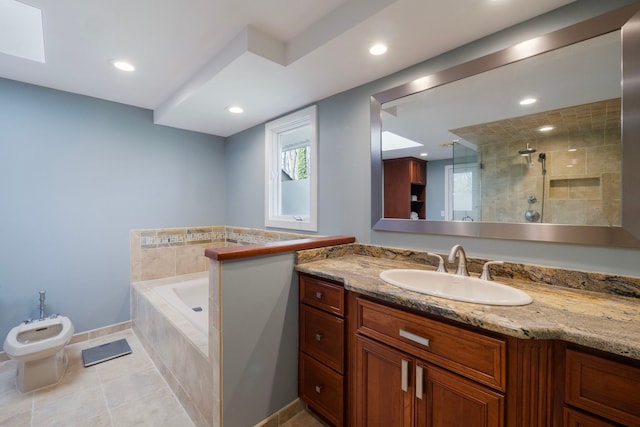 full bathroom featuring vanity, tile patterned floors, a bidet, tiled shower, and a garden tub