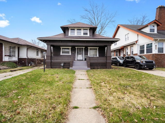 bungalow-style home with a front yard and a porch