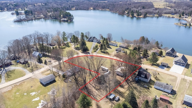 drone / aerial view with a residential view and a water view