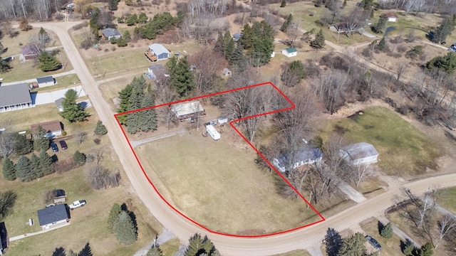 birds eye view of property featuring a rural view