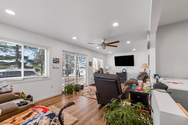 living room with ceiling fan, wood finished floors, and recessed lighting