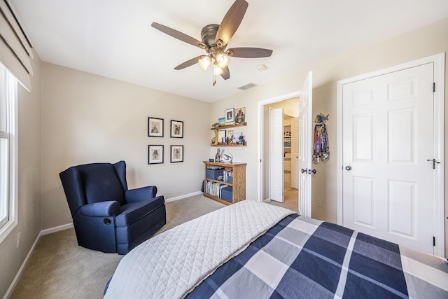 bedroom featuring ceiling fan, baseboards, and carpet floors