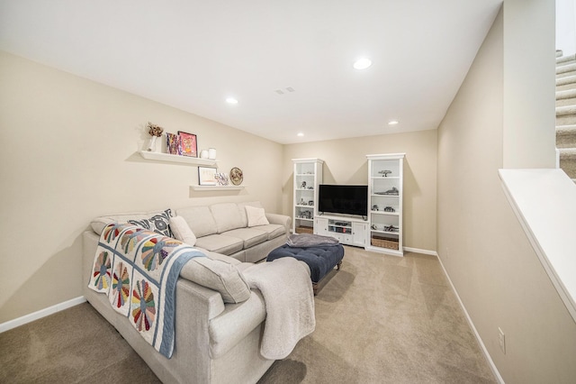 living room with light colored carpet, baseboards, and recessed lighting