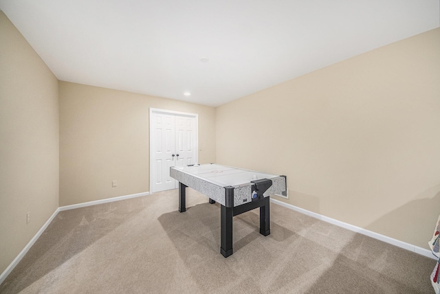 game room featuring light carpet, recessed lighting, and baseboards