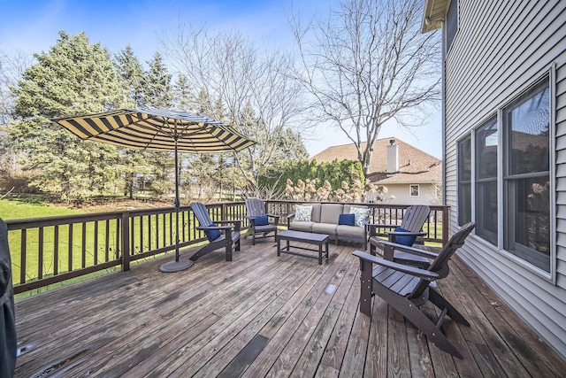 wooden deck featuring a yard and outdoor lounge area