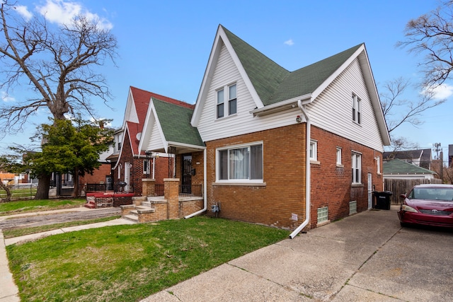 16890 Monica St, Detroit, MI 48221 - bungalow-style house featuring brick siding, fence, and a front lawn