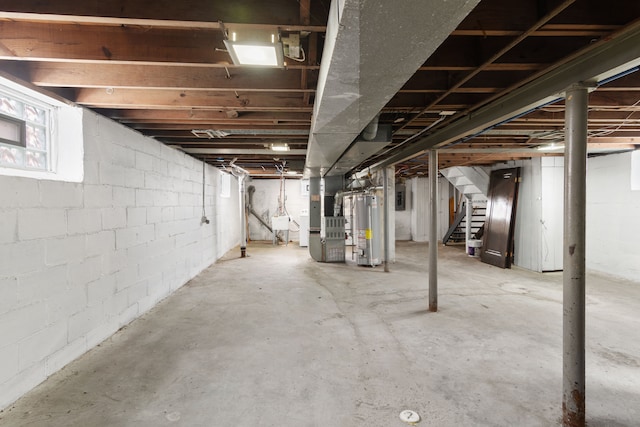 16890 Monica St, Detroit, MI 48221 - basement featuring stairs, heating unit, and gas water heater