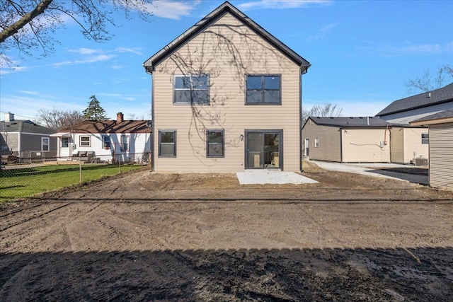 back of house featuring a patio and fence