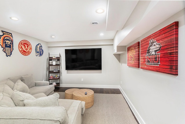 living room with recessed lighting, dark wood-style floors, baseboards, and visible vents