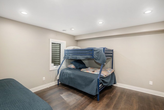 bedroom featuring baseboards, recessed lighting, and wood finished floors