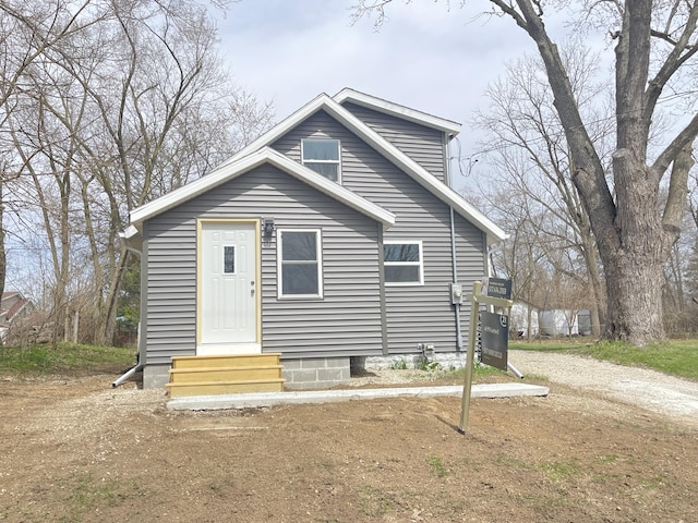 bungalow-style home featuring entry steps