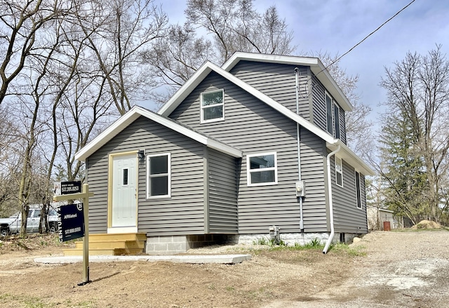 view of home's exterior with entry steps