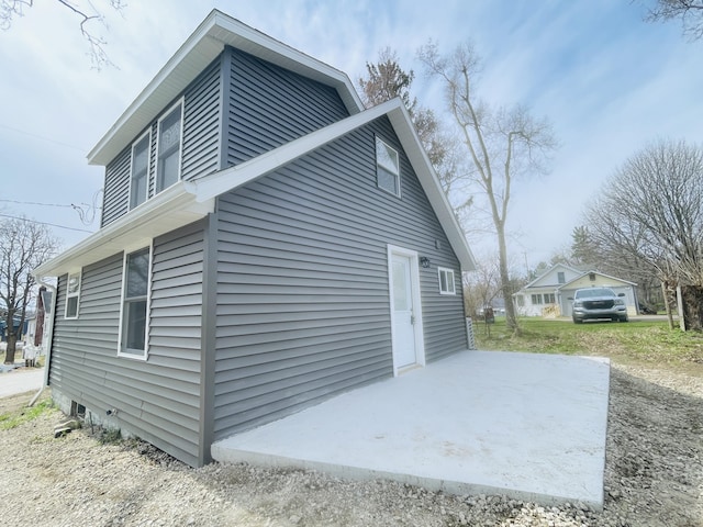 view of home's exterior with a patio
