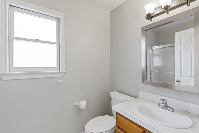 1053 Woodward Hts, Ferndale, MI 48220 - bathroom featuring toilet, an enclosed shower, and vanity